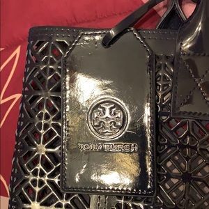 Tory Burch beach tote with cut out pattern.